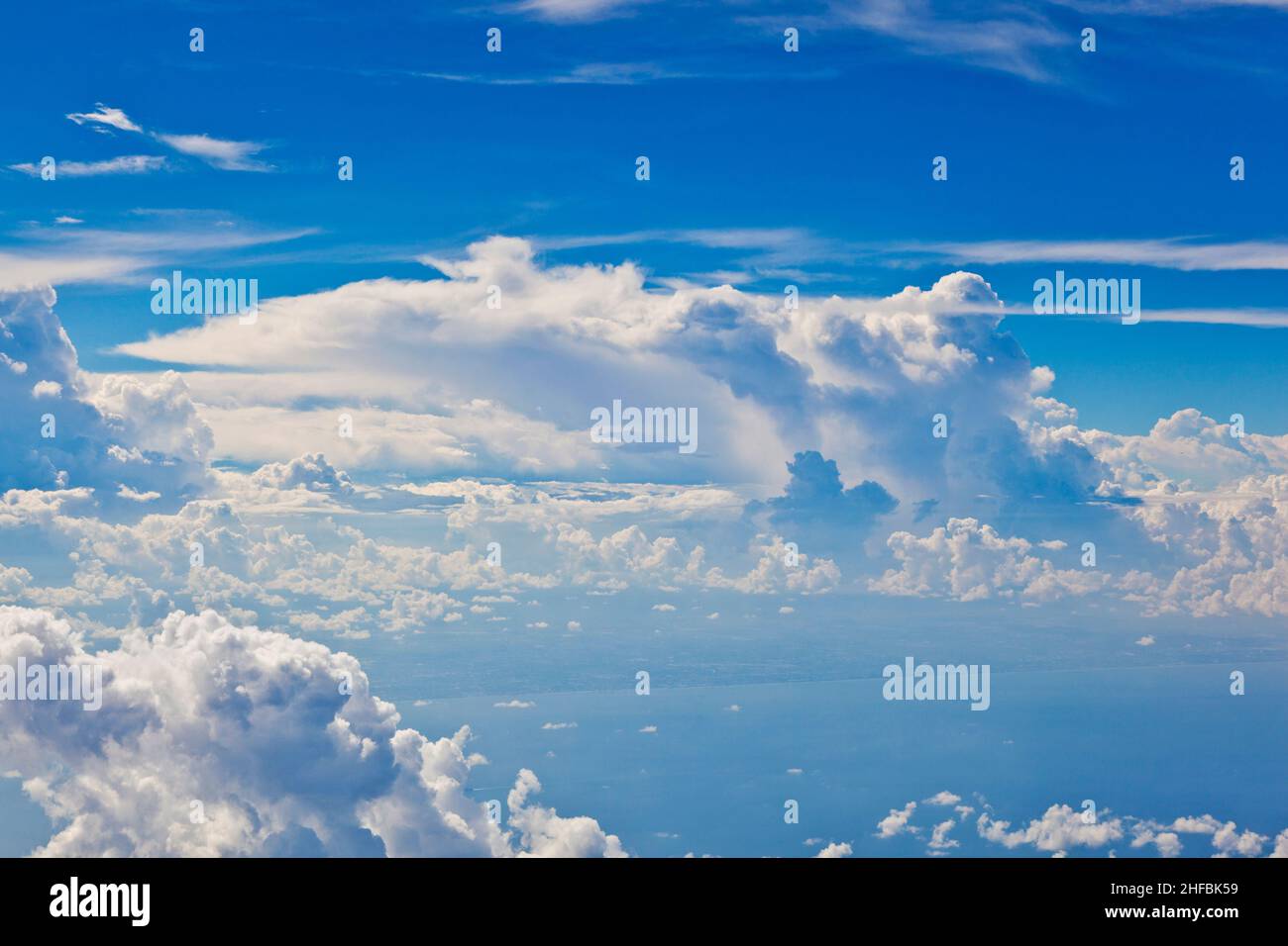 puffy white cloud blue sky Stock Photo - Alamy