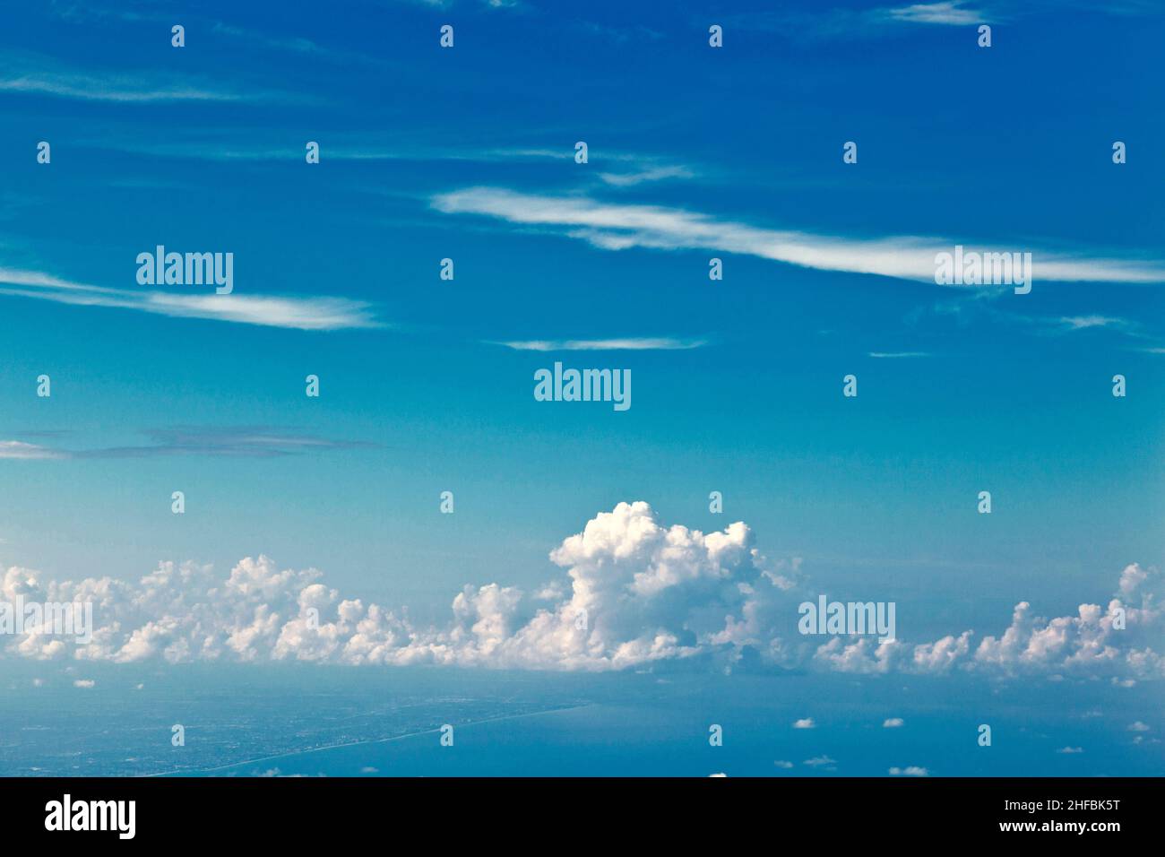 puffy white cloud blue sky Stock Photo - Alamy