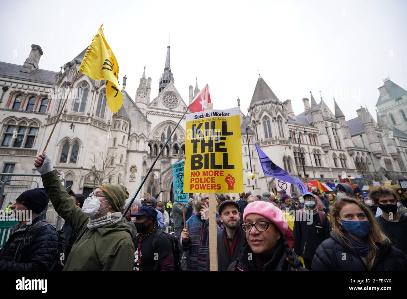 Demonstrators pass the High Court in London, during a 'Kill The Bill' protest against The Police, Crime, Sentencing and Courts Bill. Picture date: Saturday January 15, 2022. Stock Photo