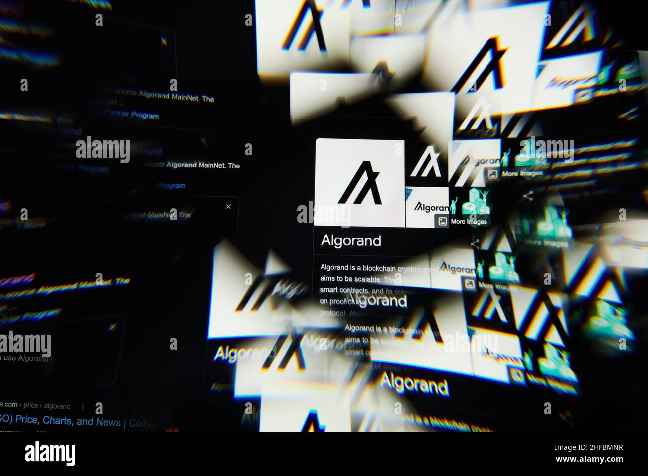 Milan, Italy - January 11, 2022: algorand - ALGO logo on laptop screen seen through an optical prism. Dynamic and unique image form algorand, ALGO coi Stock Photo