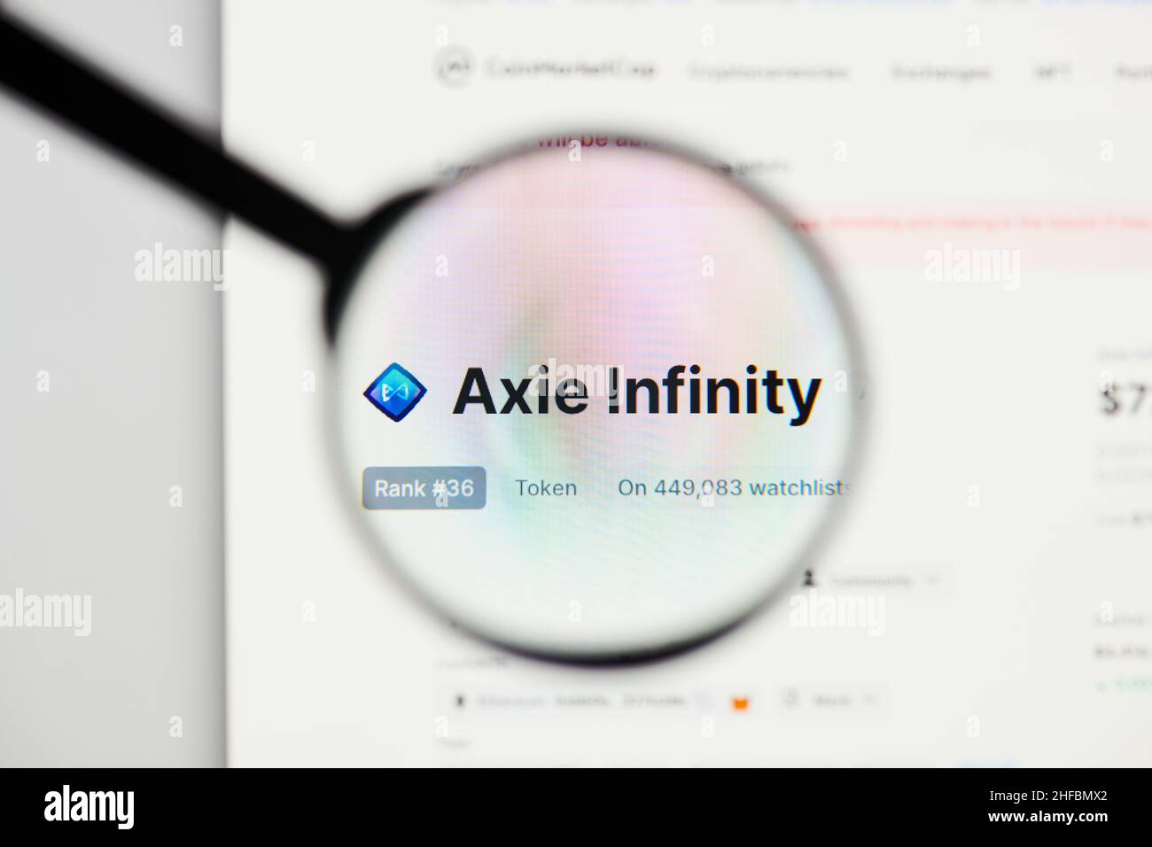 Milan, Italy - January 11, 2022: axie infinity - AXS website's hp.  axie infinity, AXS coin logo visible through a loope. Defi, ntf, cryptocurrency co Stock Photo
