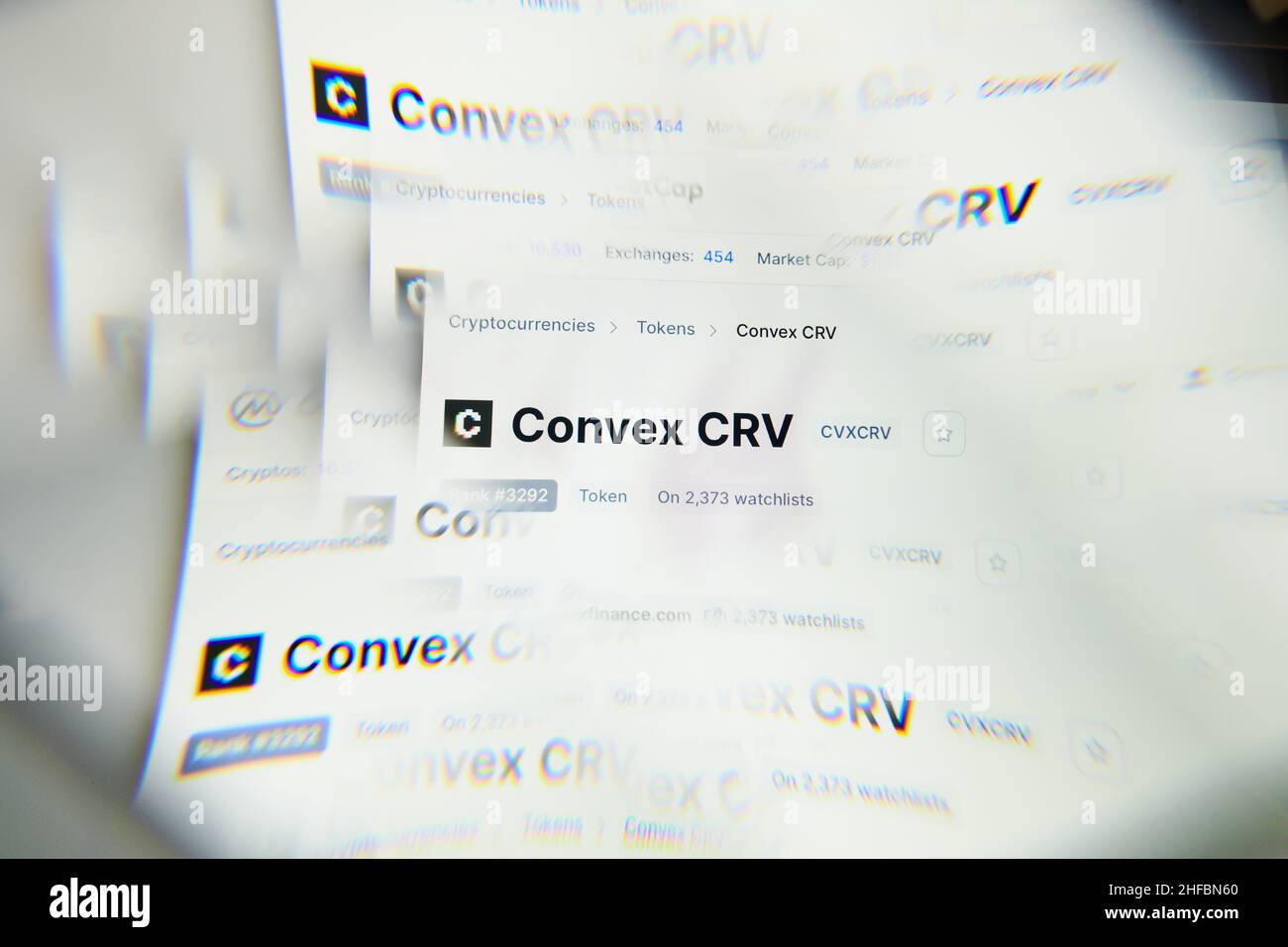 Milan, Italy - January 11, 2022: convex crv - CVXCRV logo on laptop screen seen through an optical prism. Dynamic and unique image form convex crv, CV Stock Photo