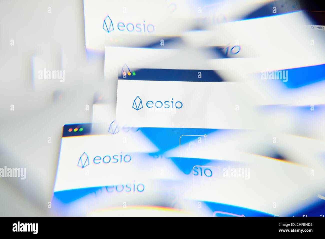 Milan, Italy - January 11, 2022: eos - EOS logo on laptop screen seen through an optical prism. Dynamic and unique image form eos, EOS coin website. I Stock Photo