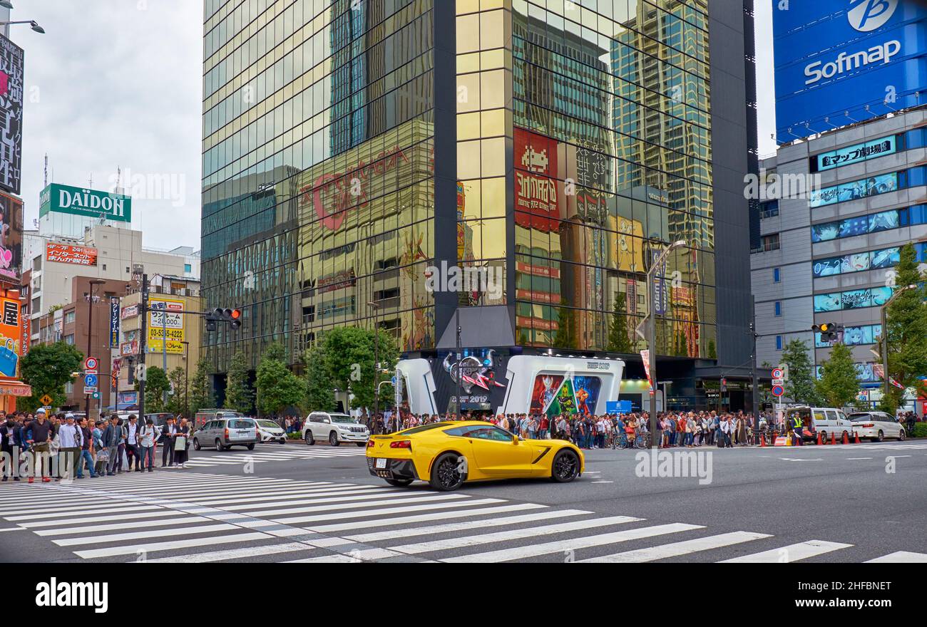 Tokyo, Japan - October 26, 2019: The view of Akihabara buzy crossroads surrounded by the many manga, anime and electronic shops icons. Chiyoda ward. T Stock Photo