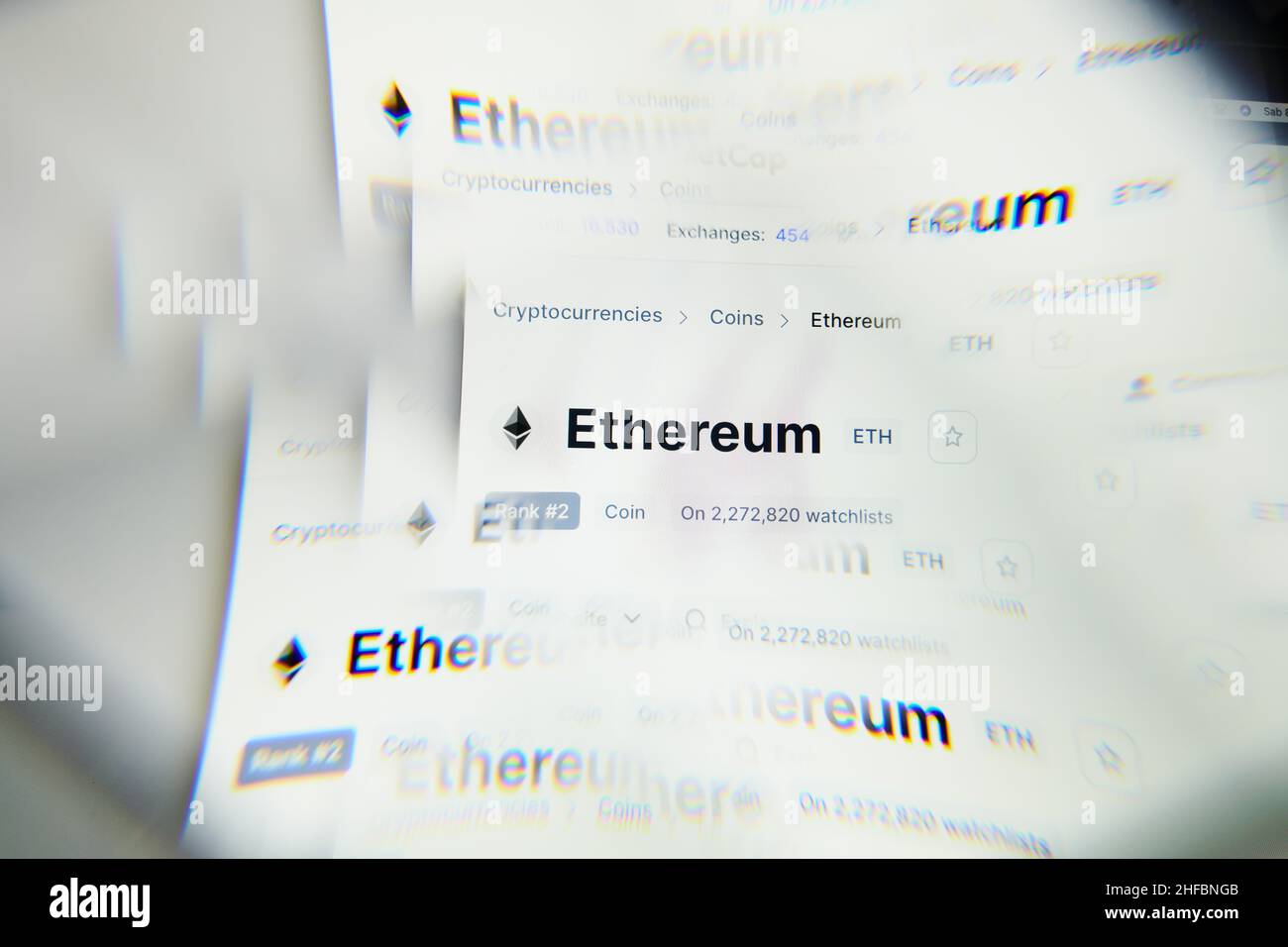 Milan, Italy - January 11, 2022: Etherum - ETH logo on laptop screen seen through an optical prism. Dynamic and unique image form Etherum, ETH coin we Stock Photo