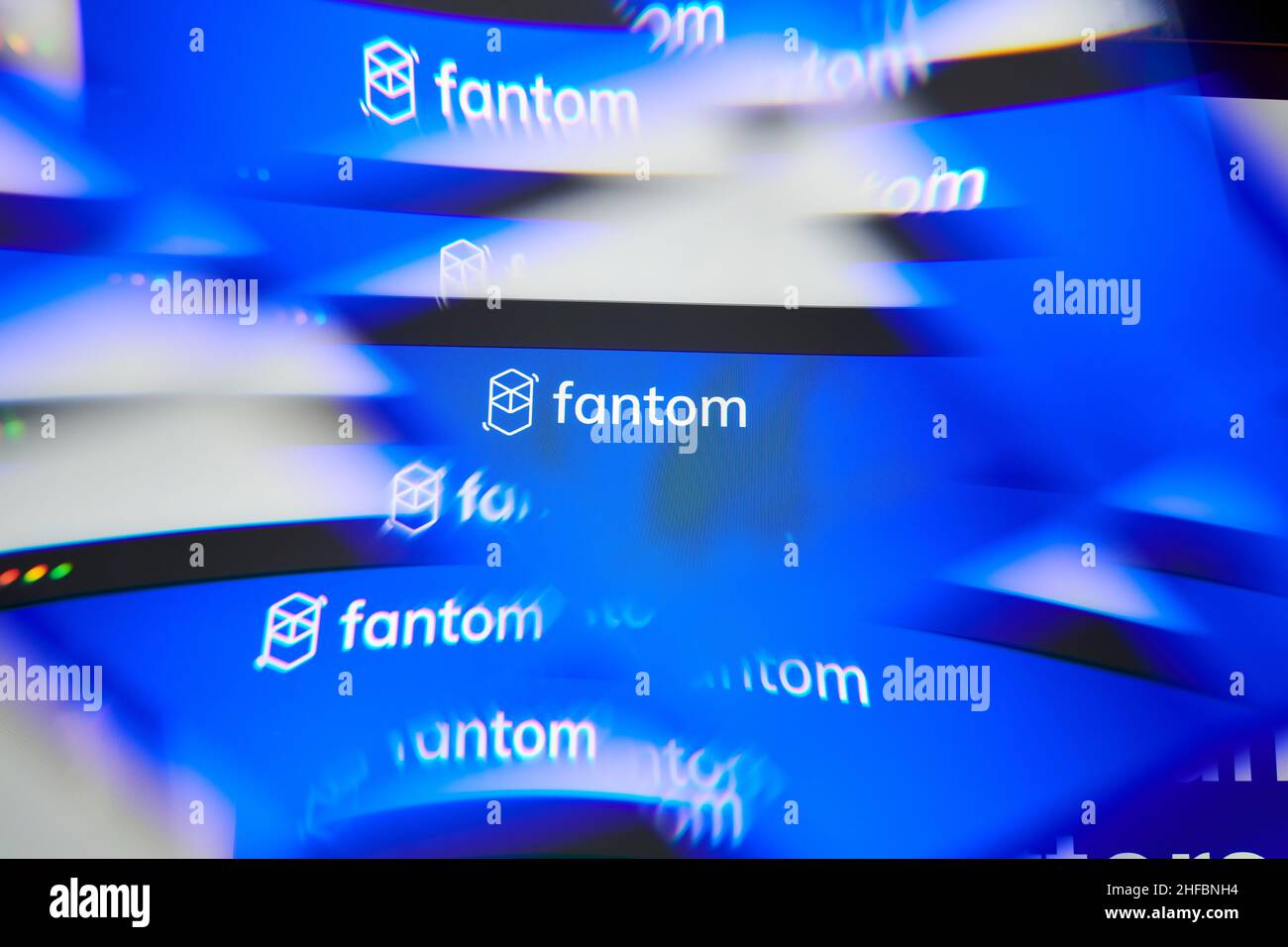 Milan, Italy - January 11, 2022: fantom - FTM logo on laptop screen seen through an optical prism. Dynamic and unique image form fantom, FTM coin webs Stock Photo