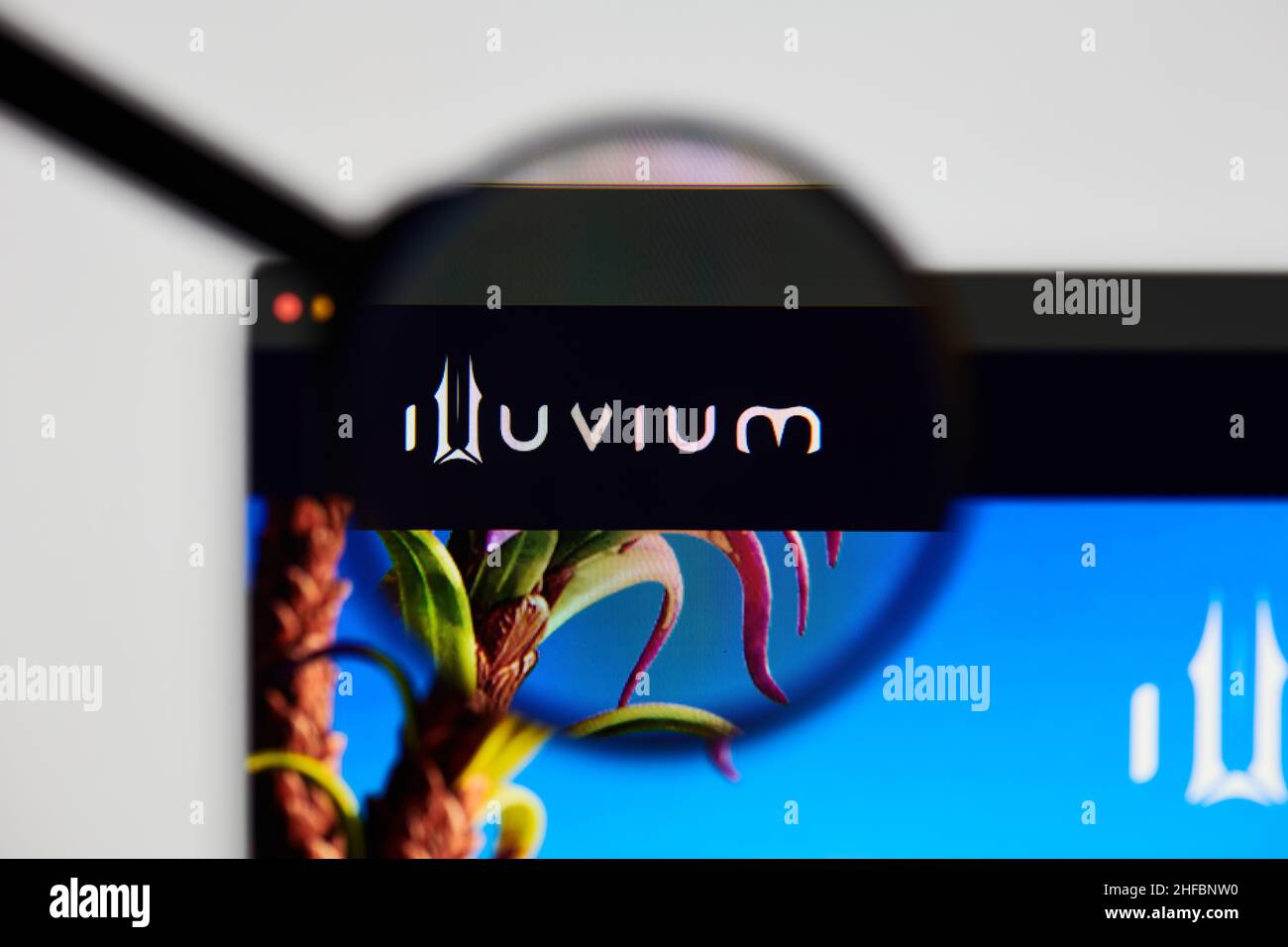 Milan, Italy - January 11, 2022: illuvium - ILV website's hp.  illuvium, ILV coin logo visible through a loope. Defi, ntf, cryptocurrency concepts ill Stock Photo