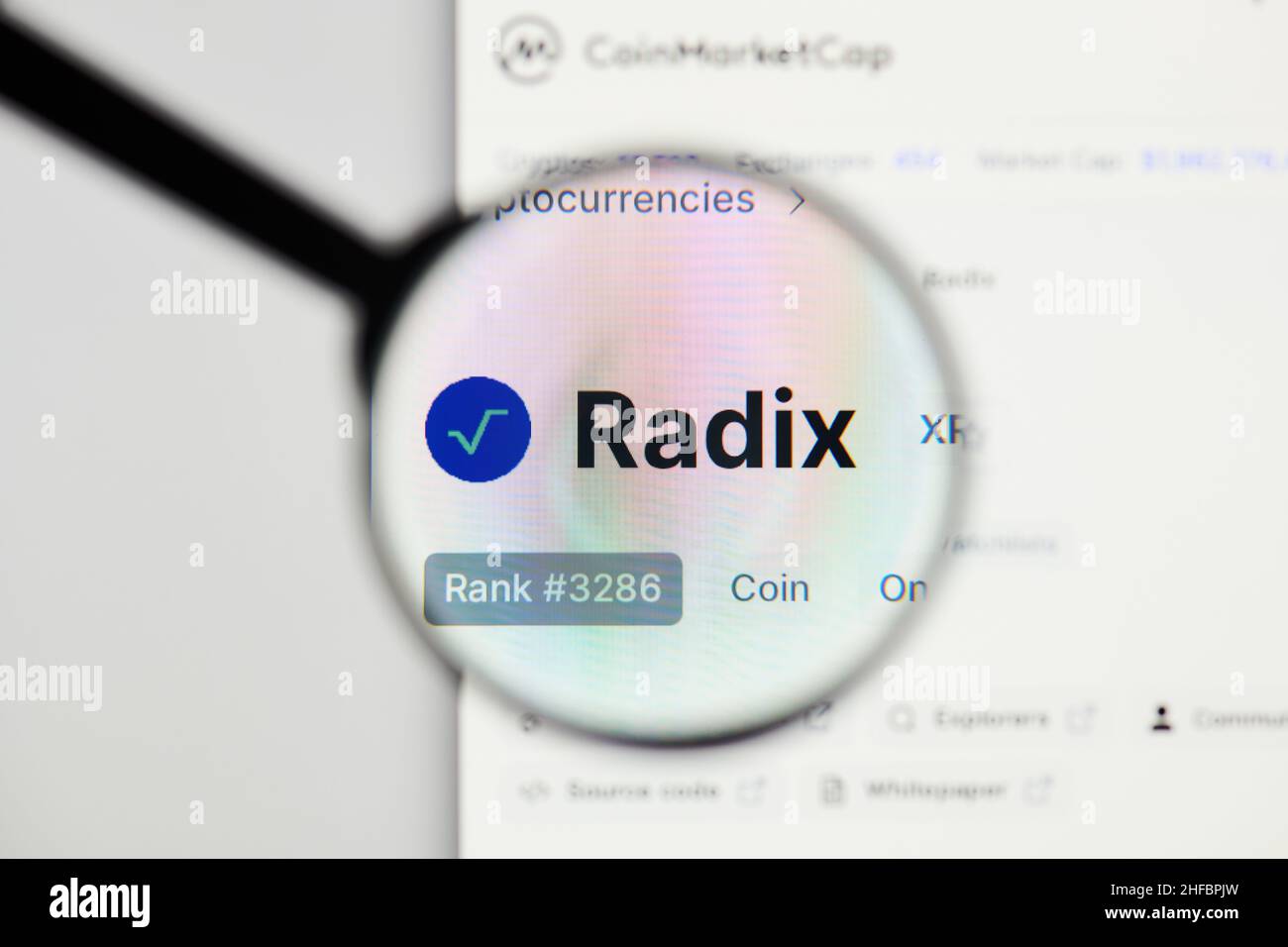 Milan, Italy - January 11, 2022: radix - XRD website's hp.  radix, XRD coin logo visible through a loope. Defi, ntf, cryptocurrency concepts illustrat Stock Photo