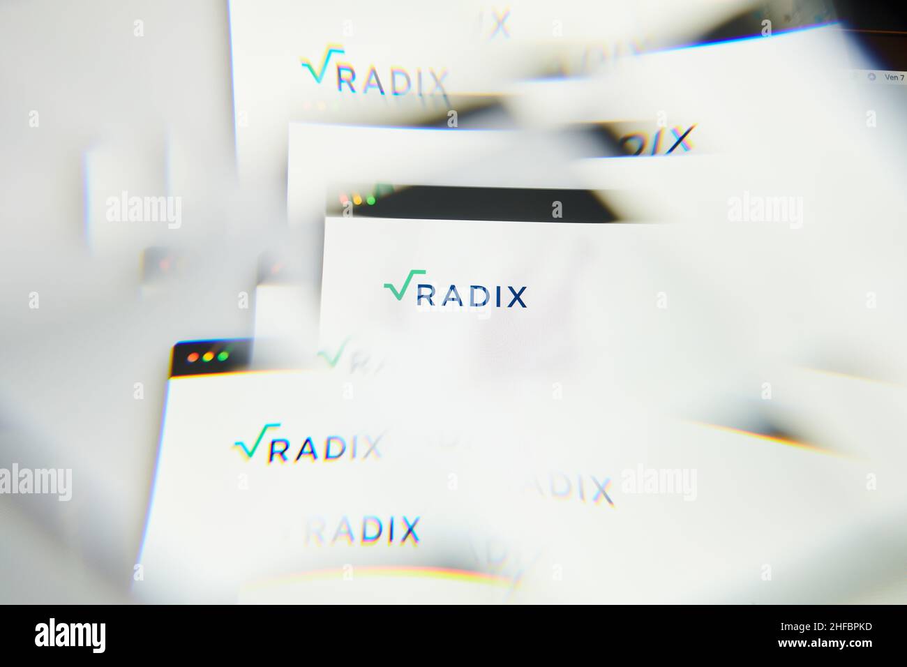 Milan, Italy - January 11, 2022: radix - XRD logo on laptop screen seen through an optical prism. Dynamic and unique image form radix, XRD coin websit Stock Photo
