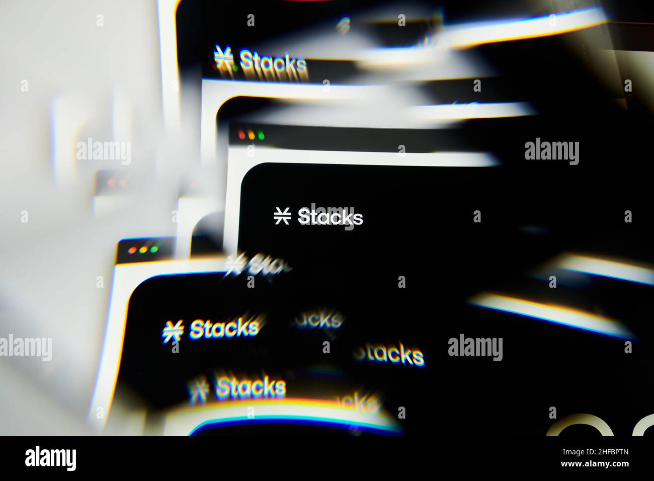 Milan, Italy - January 11, 2022: stacks - STX logo on laptop screen seen through an optical prism. Dynamic and unique image form stacks, STX coin webs Stock Photo