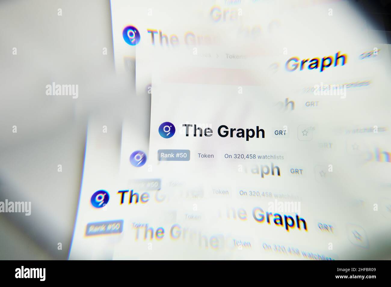 Milan, Italy - January 11, 2022: the graph - GRT logo on laptop screen seen through an optical prism. Dynamic and unique image form the graph, GRT coi Stock Photo