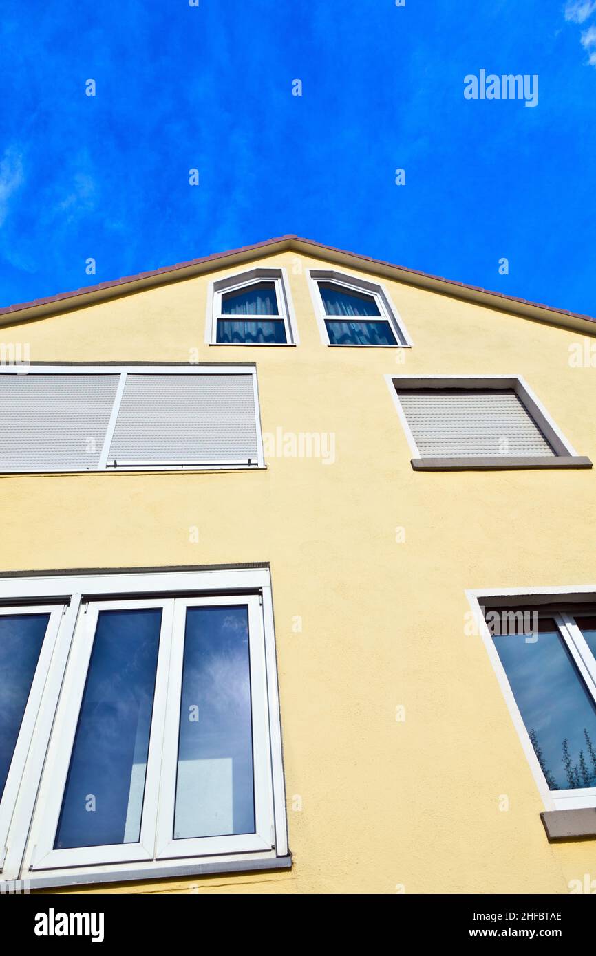 Abstract house facade under the blue sky Stock Photo - Alamy