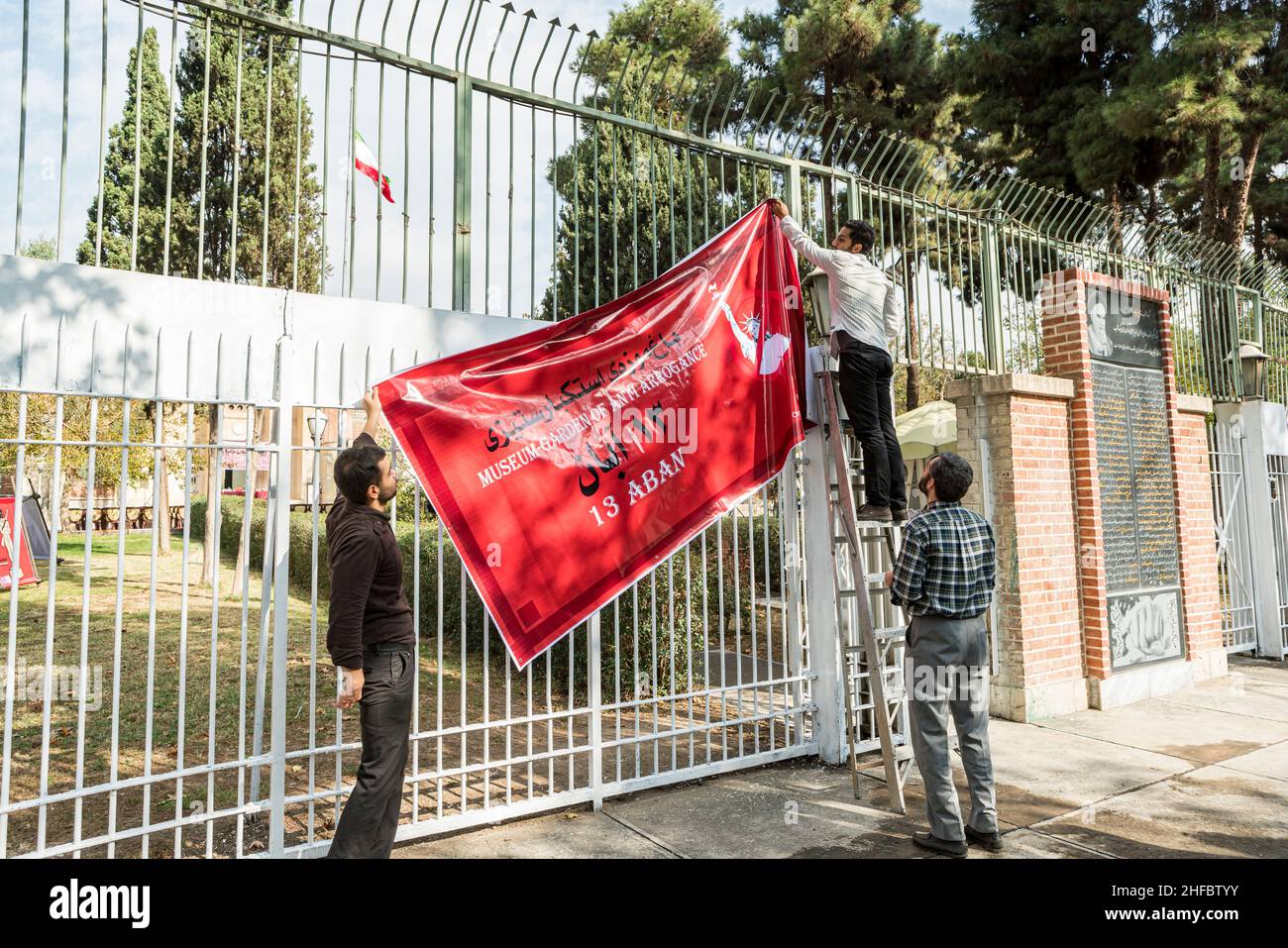 Raising A Banner Commemorating The Takeover Of The US Embassy In Tehran 