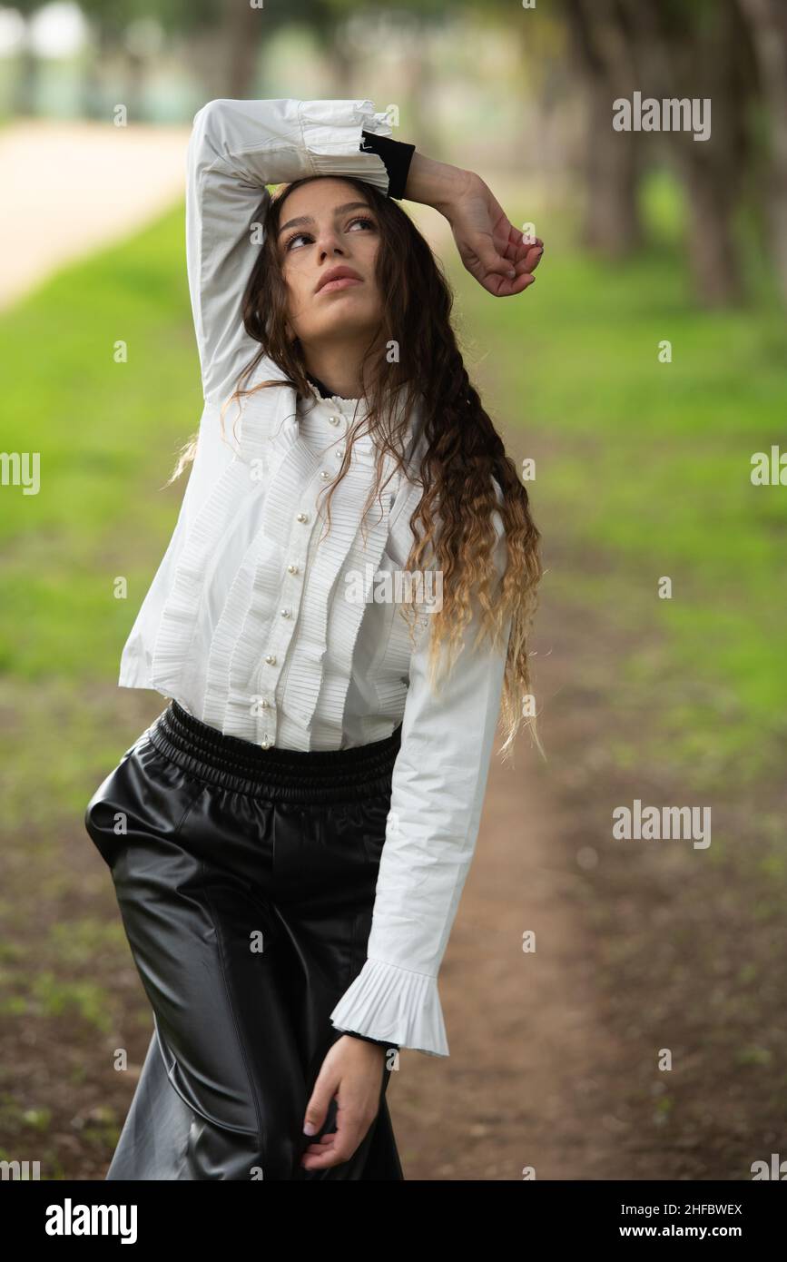 Young woman dancing outdoors. Dance performance in the street Stock Photo