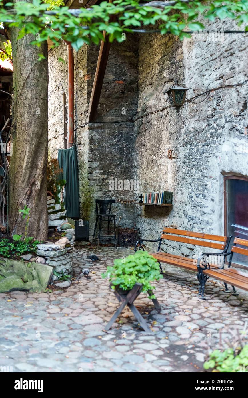 Cozy courtyard with benches in old town Stock Photo - Alamy