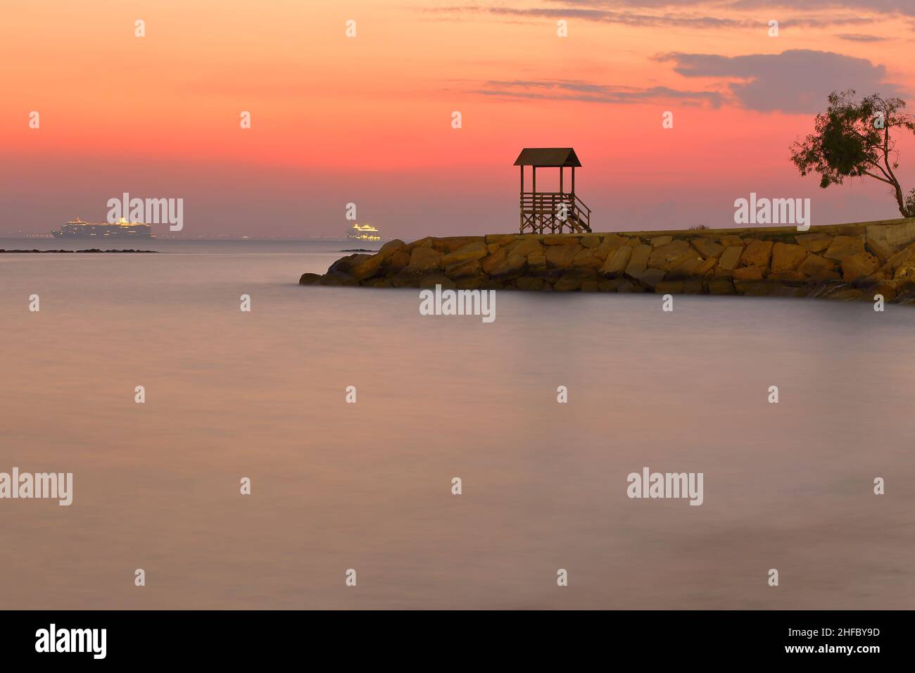 Seascape with Mediterranean island at sunset time Stock Photo
