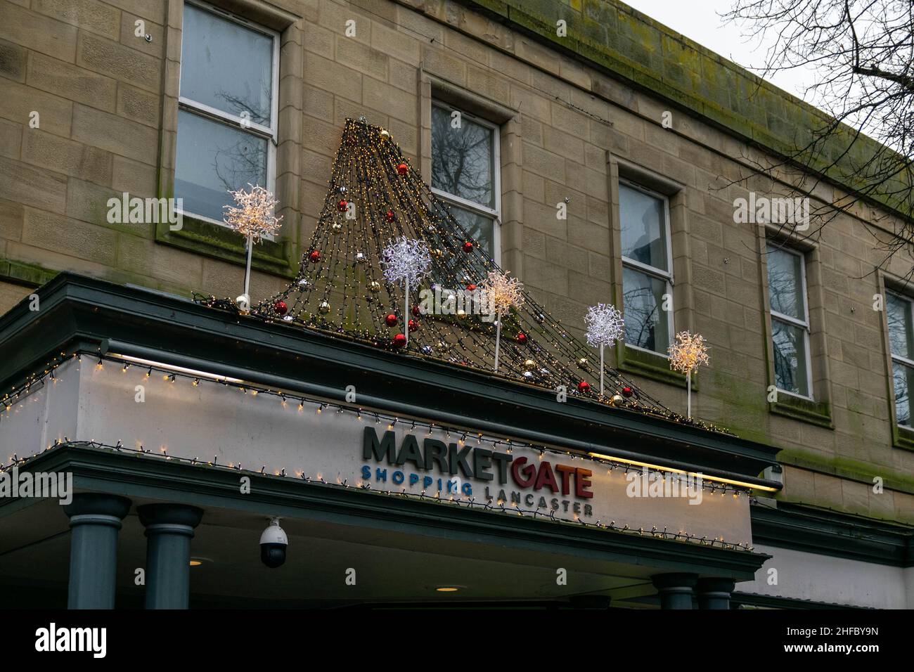 Lancaster, UK - 4th January 2020 - MarketGate Shopping Centre in city centre Lancaster, Lancashire with festive Christmas decorations welcoming shops Stock Photo