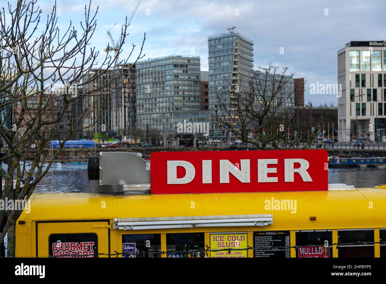 Liverpool, UK - 6 January 2020: A yellow Dinner bus restaurant serving food and drinks in Liverpool city centre on the Merseyside dock Stock Photo