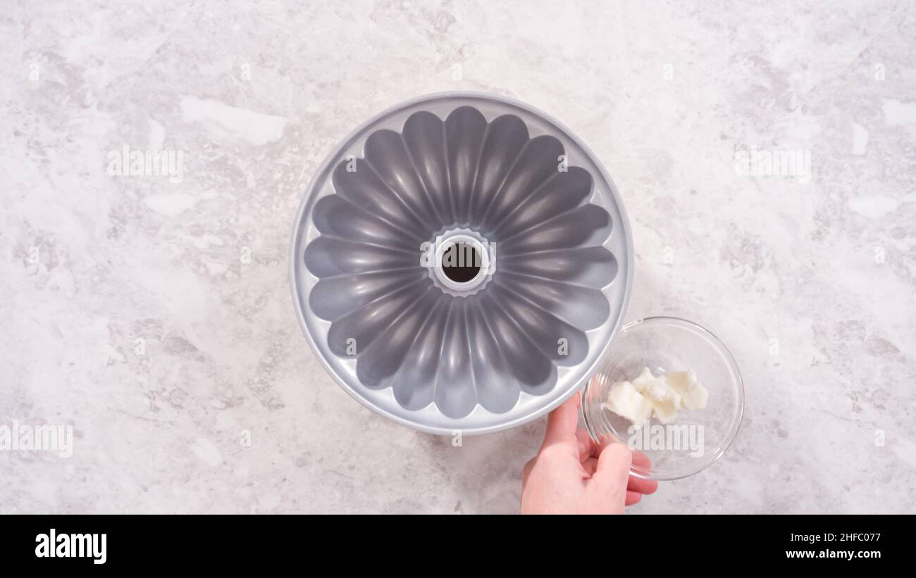 Flat lay. Step by step. Greasing bundt cake pan with vegetable