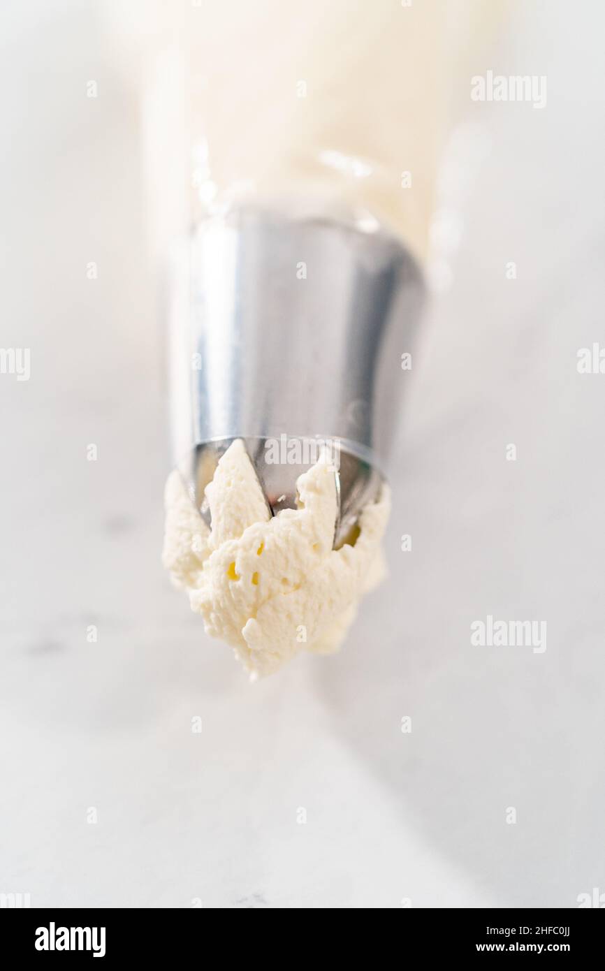 Homemade whipped cream in a piping bag with a metal tip Stock Photo - Alamy