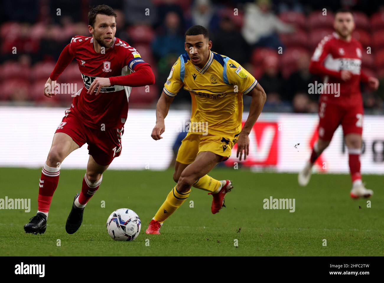 Middlesbrough's Jonny Howson and Reading's Andy Rinomhota during the Sky Bet Championship match at Riverside Stadium, Middlesbrough. Picture date: Saturday January 15, 2022. Stock Photo