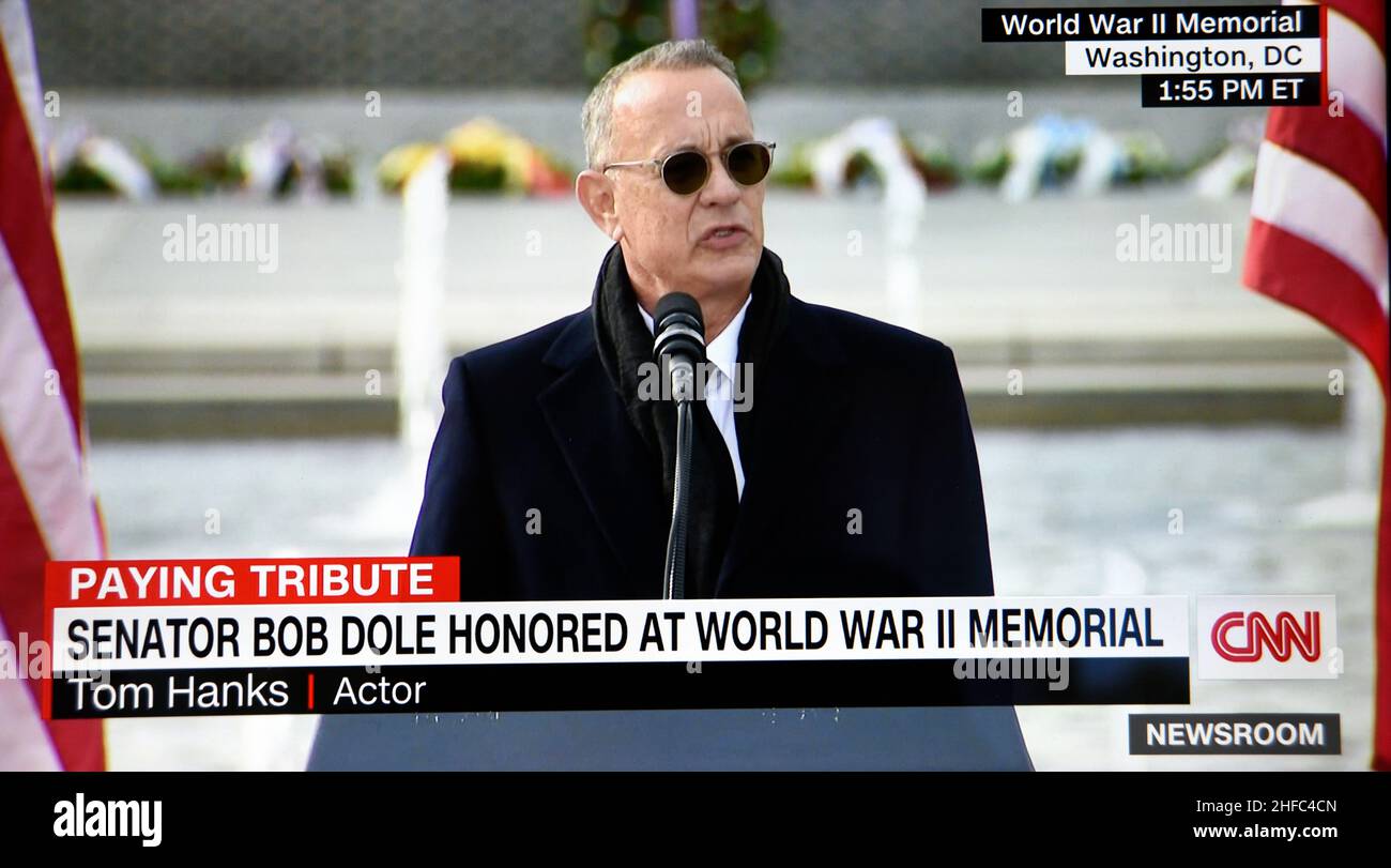 A CNN TV screenshot of actor Tom Hanks paying tribute to the late U.S. Senator Bob Dole at an event at the World War II Memorial in Washington, D.C. Stock Photo