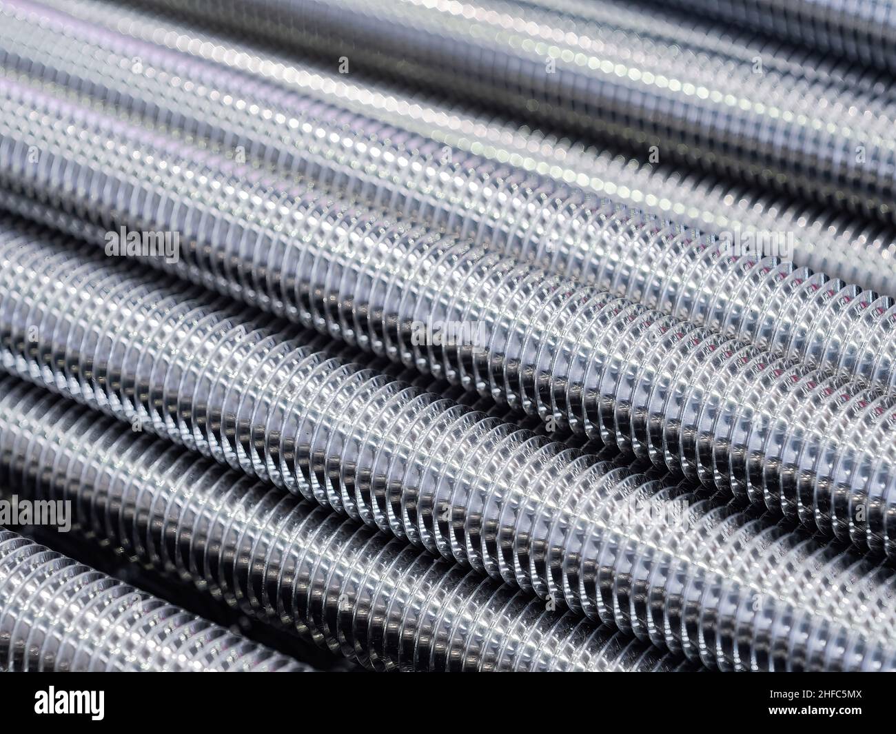 https://c8.alamy.com/comp/2HFC5MX/stainless-steel-threaded-rods-abstract-background-2HFC5MX.jpg