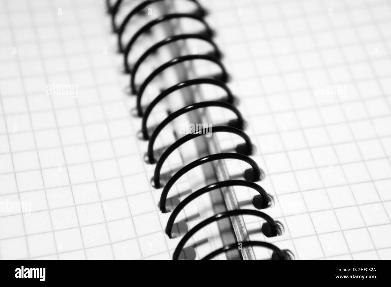 notepad in the cage, on the spring black and white Stock Photo