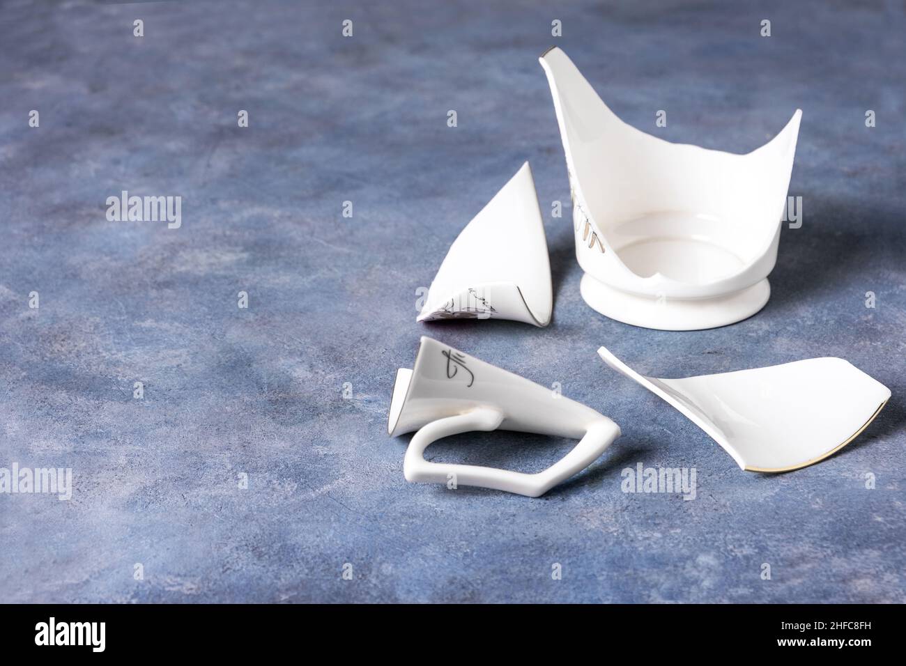 Fragments of white fragile porcelain cup Stock Photo Alamy