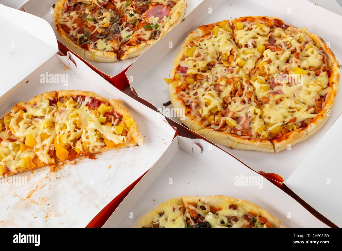 exquisite fast food in cardboard boxes, pizza with ingredients of