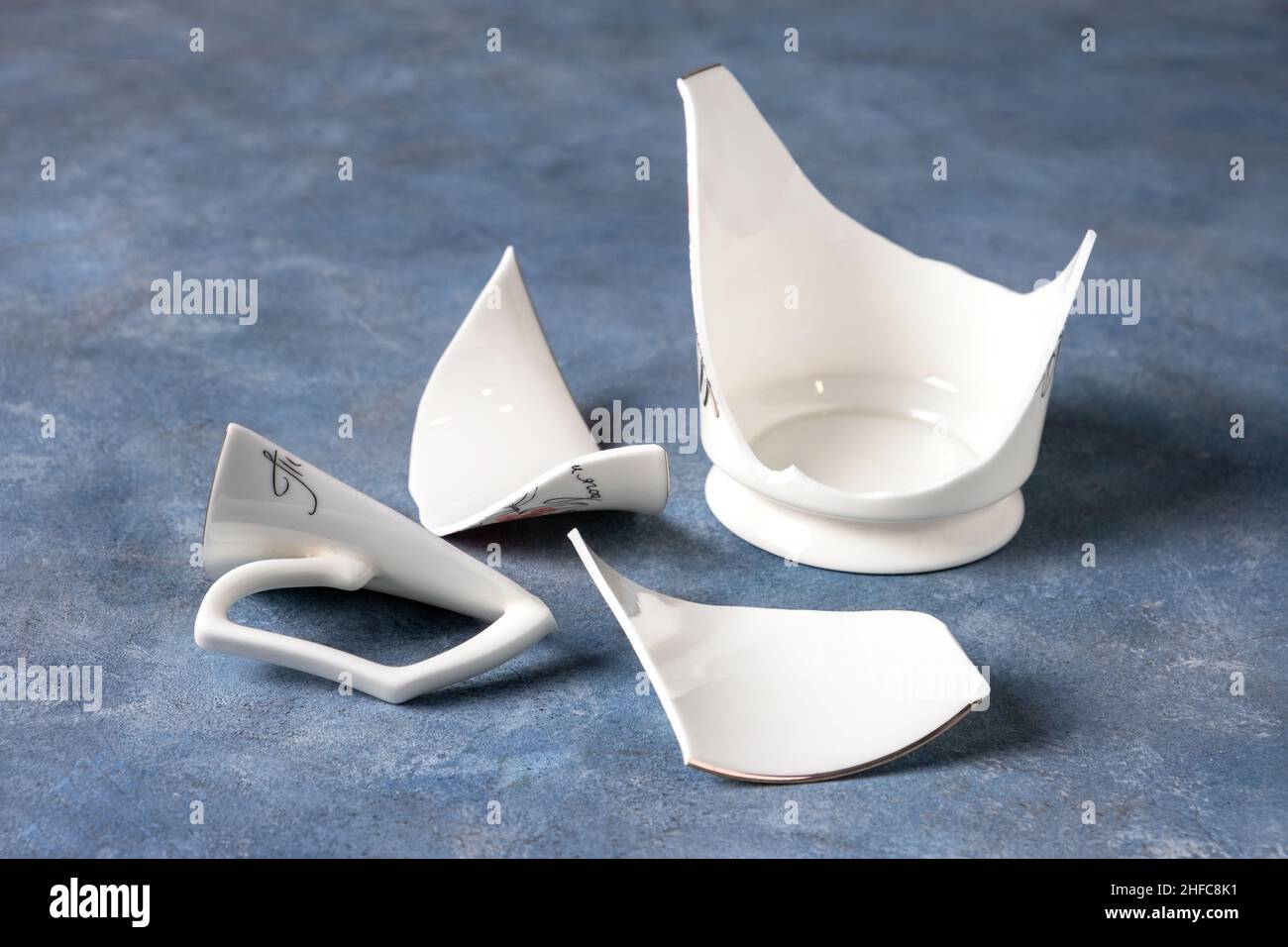 Fragments of white fragile porcelain cup Stock Photo Alamy