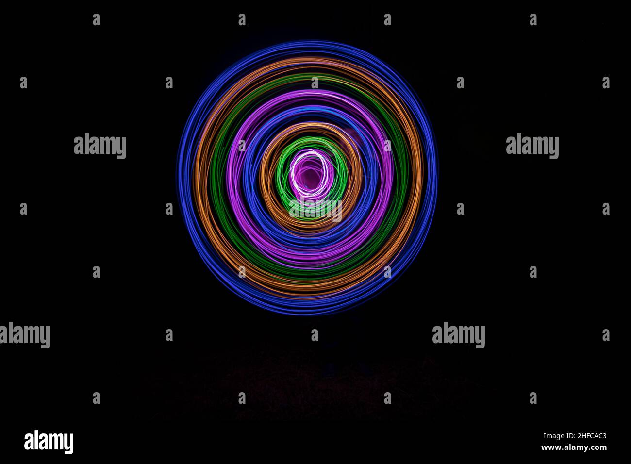Multicolored circles on a black background Stock Photo