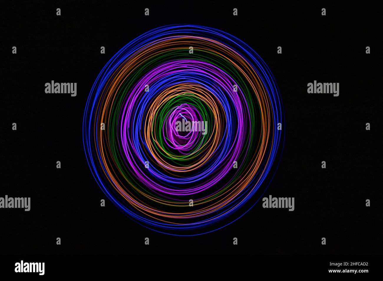Multicolored circles on a black background Stock Photo