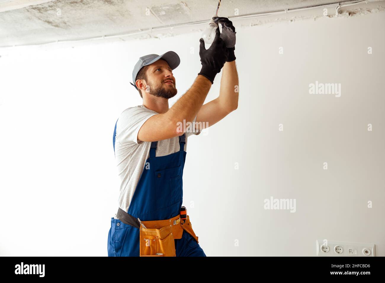 Installing a ceiling fixture hi-res stock photography and images - Alamy