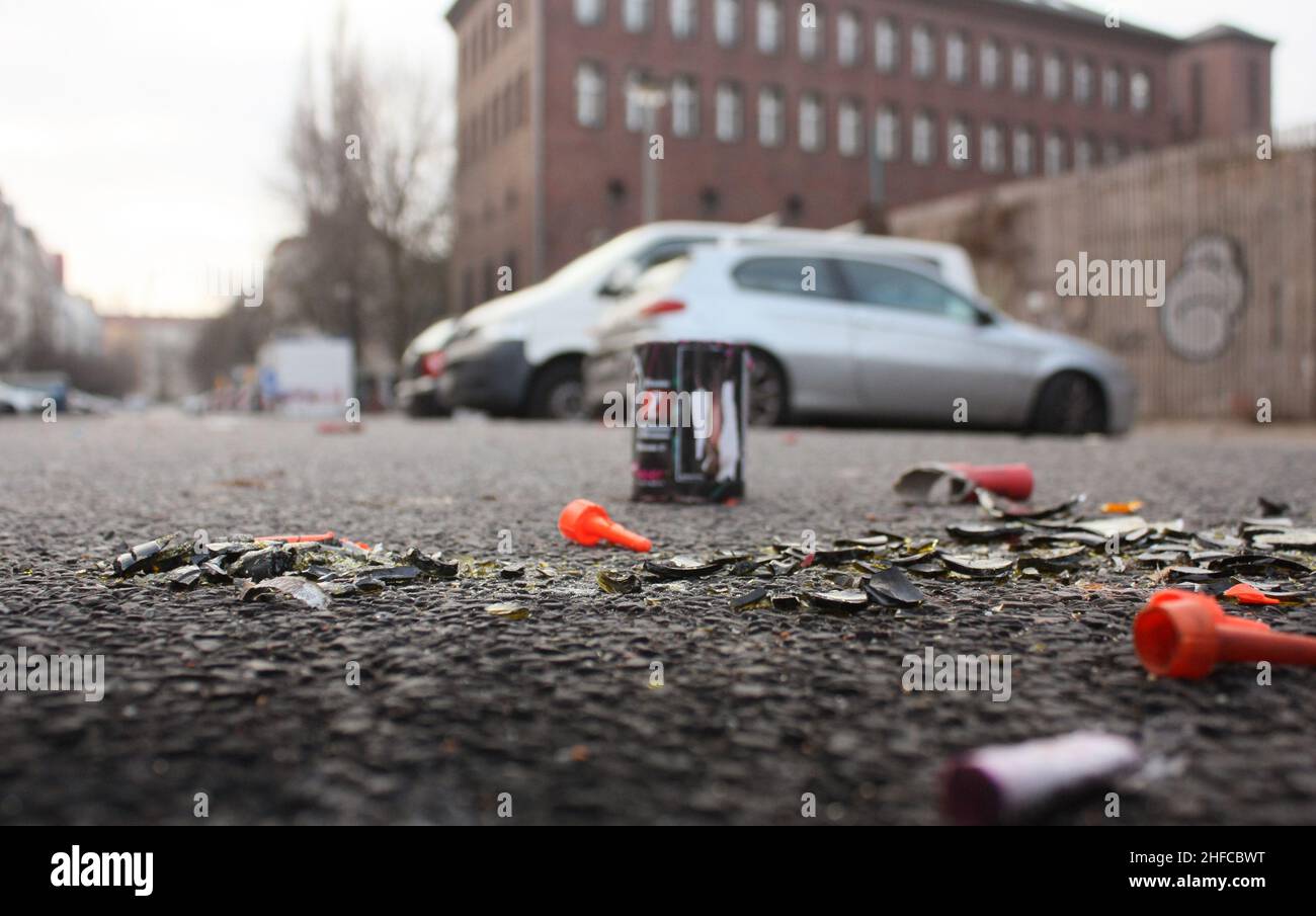 plastic trash and broken glass on the street after New Year celebrations in Berlin Stock Photo