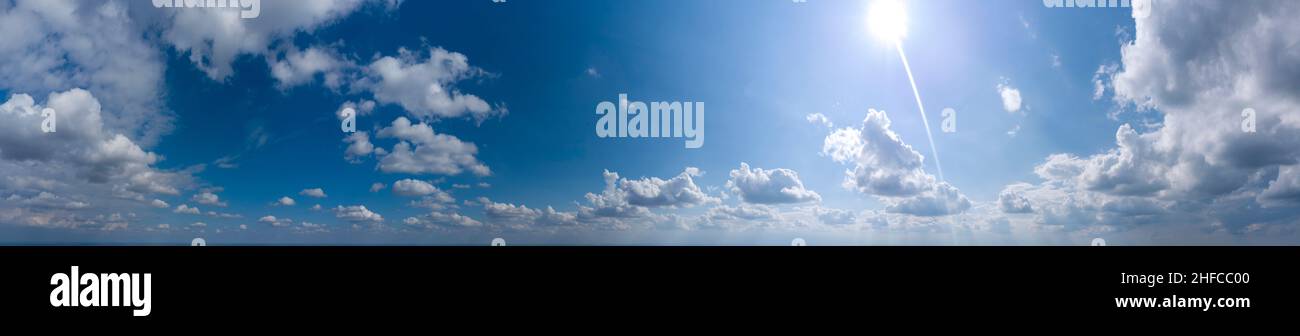 panorama of blue sky with clouds and sun Stock Photo - Alamy