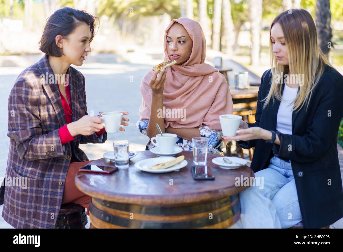 Hijab women drinking coffee hi-res stock photography and images - Alamy