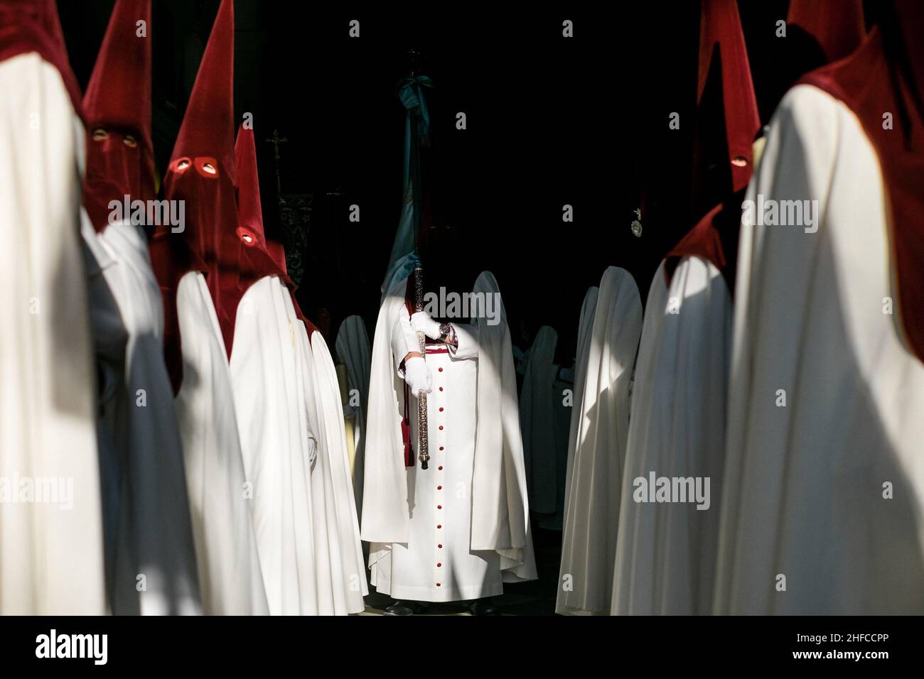 People dressed in typical Spanish Easter costumes are prepared for the religious procession. Stock Photo