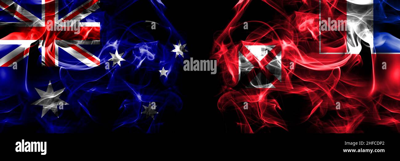 Flags of Australia, Australian vs France, French, Wallis and Futuna. Smoke flag placed side by side on black background. Stock Photo