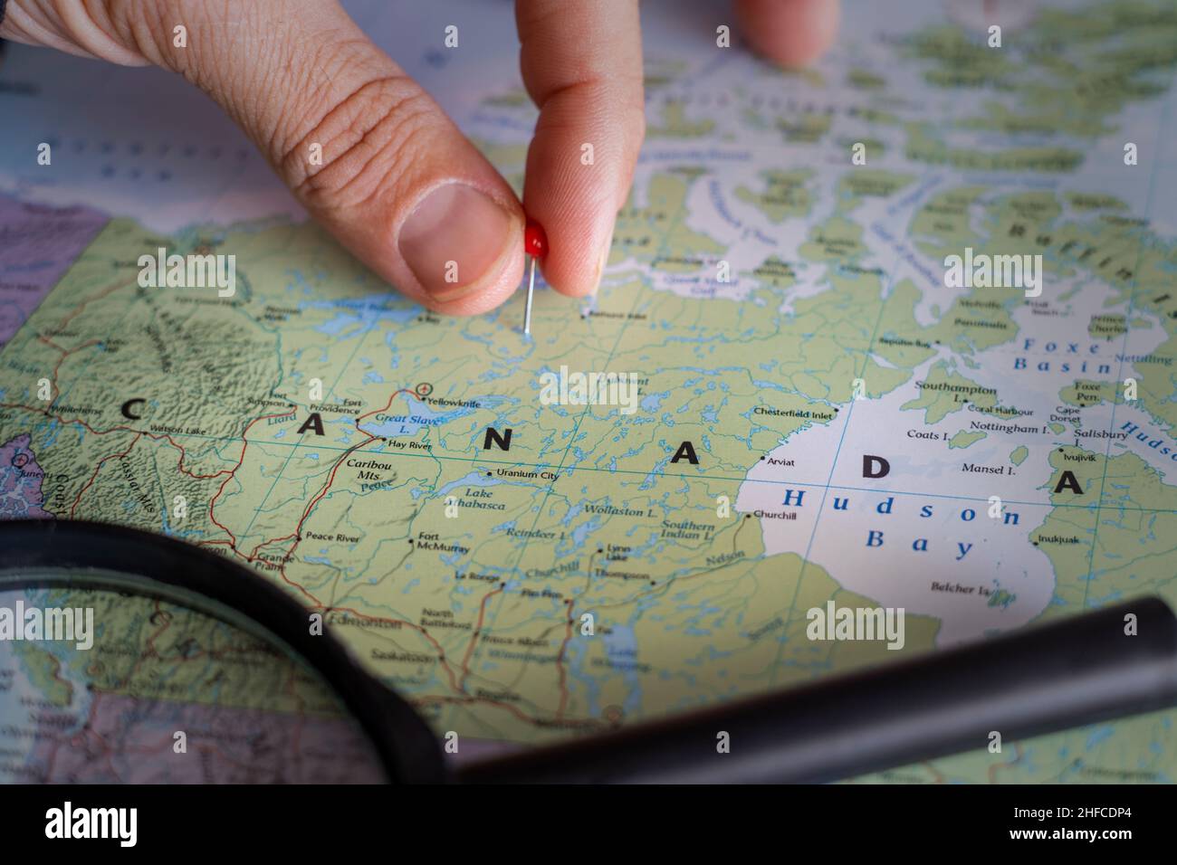 Canada pin on a world map. Canada travel destination planning pinned Stock Photo