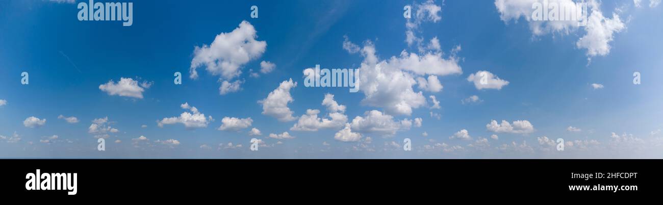 White loose clouds on a blue sky Stock Photo