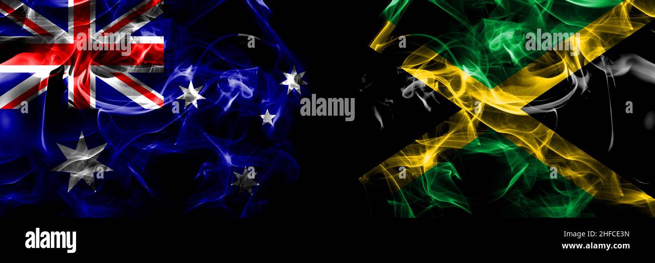 Flags of Australia, Australian vs Jamaica, Jamaican. Smoke flag placed side by side on black background. Stock Photo