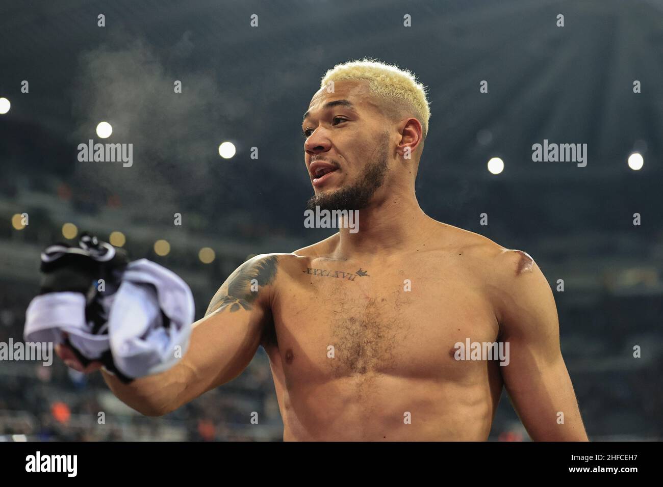 Joelinton #7 of Newcastle United takes off his shirt before giving