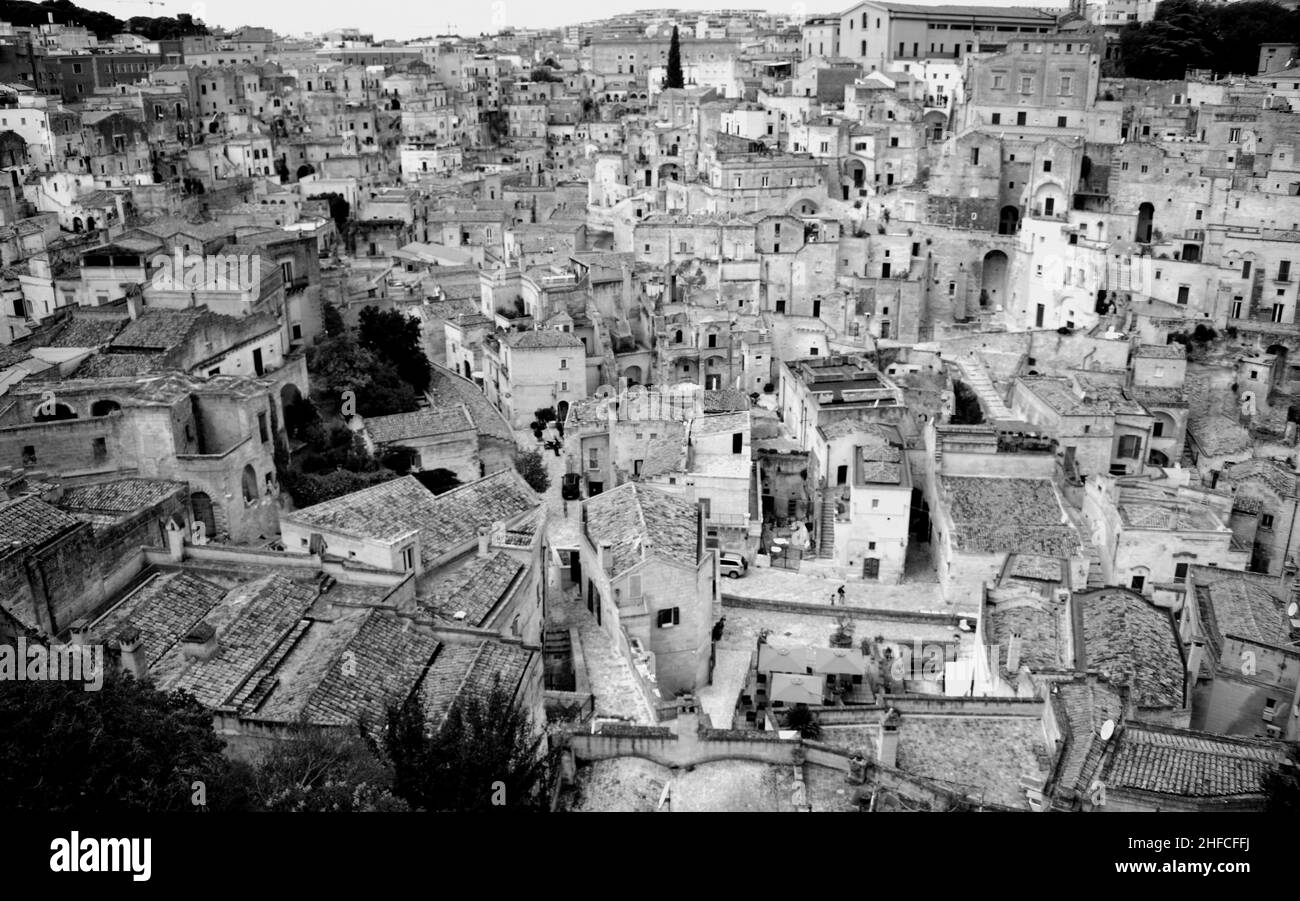 Matera is a city located on a rocky outcrop in Basilicata, in Southern Italy. It includes the Sassi area, a complex of Cave Houses carved into the mou Stock Photo