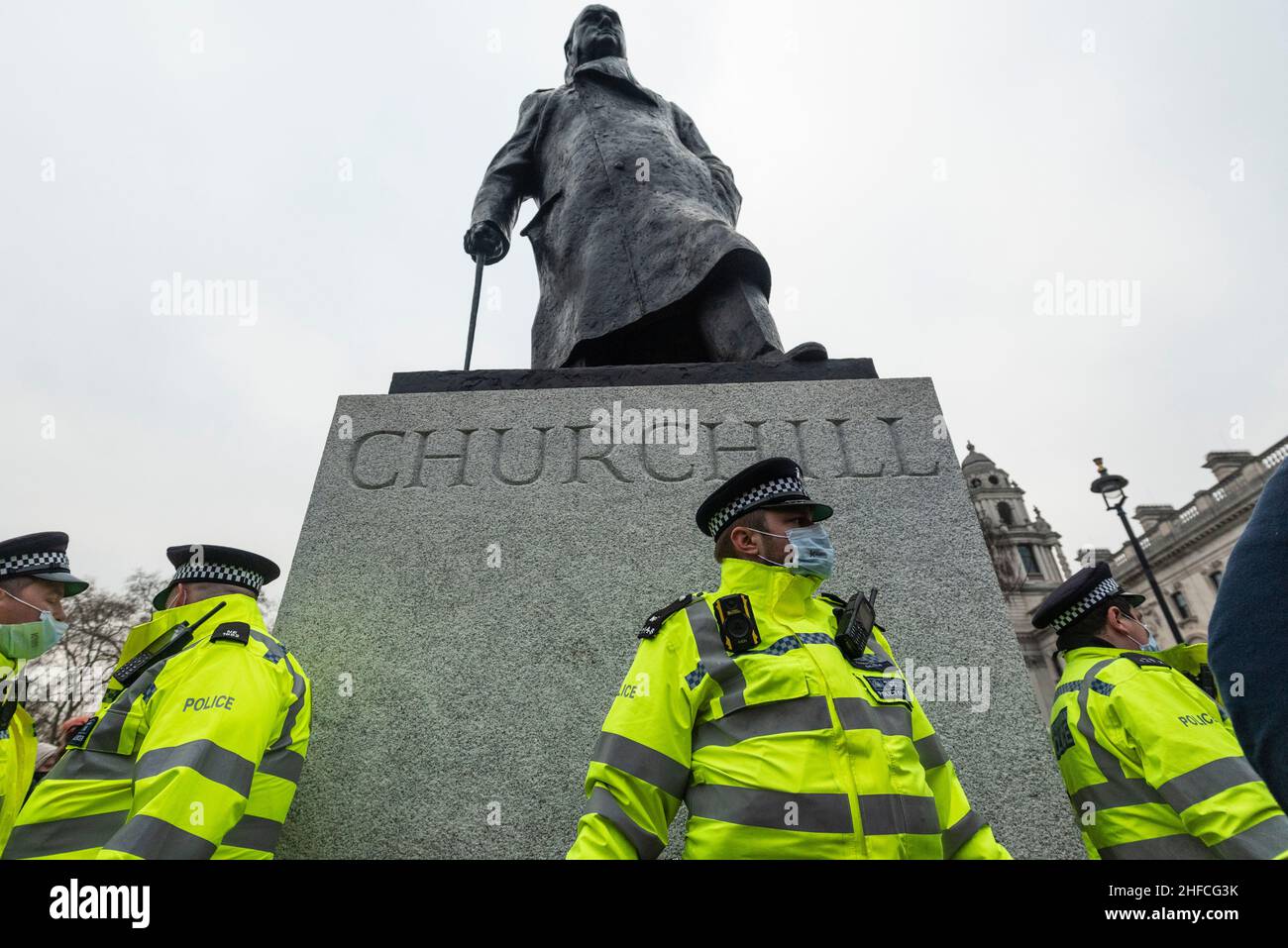 London, UK.  15 January 2022.  Police surround the Winston Churchill statue in Parliament Square during a Kill the Bill protest in central London.  The protests were prompted by the Police, Crime, Sentencing and Courts Bill, which propose to give police in England and Wales more power to impose conditions on non-violent protests, including those which are deemed too noisy or a nuisance. Credit: Stephen Chung / Alamy Live News Stock Photo