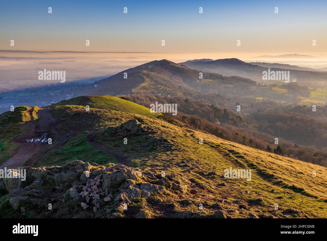 Sunlit granite rocks at Worcestershire Beacon on a winter's afternoon in the Malverns, England Stock Photo