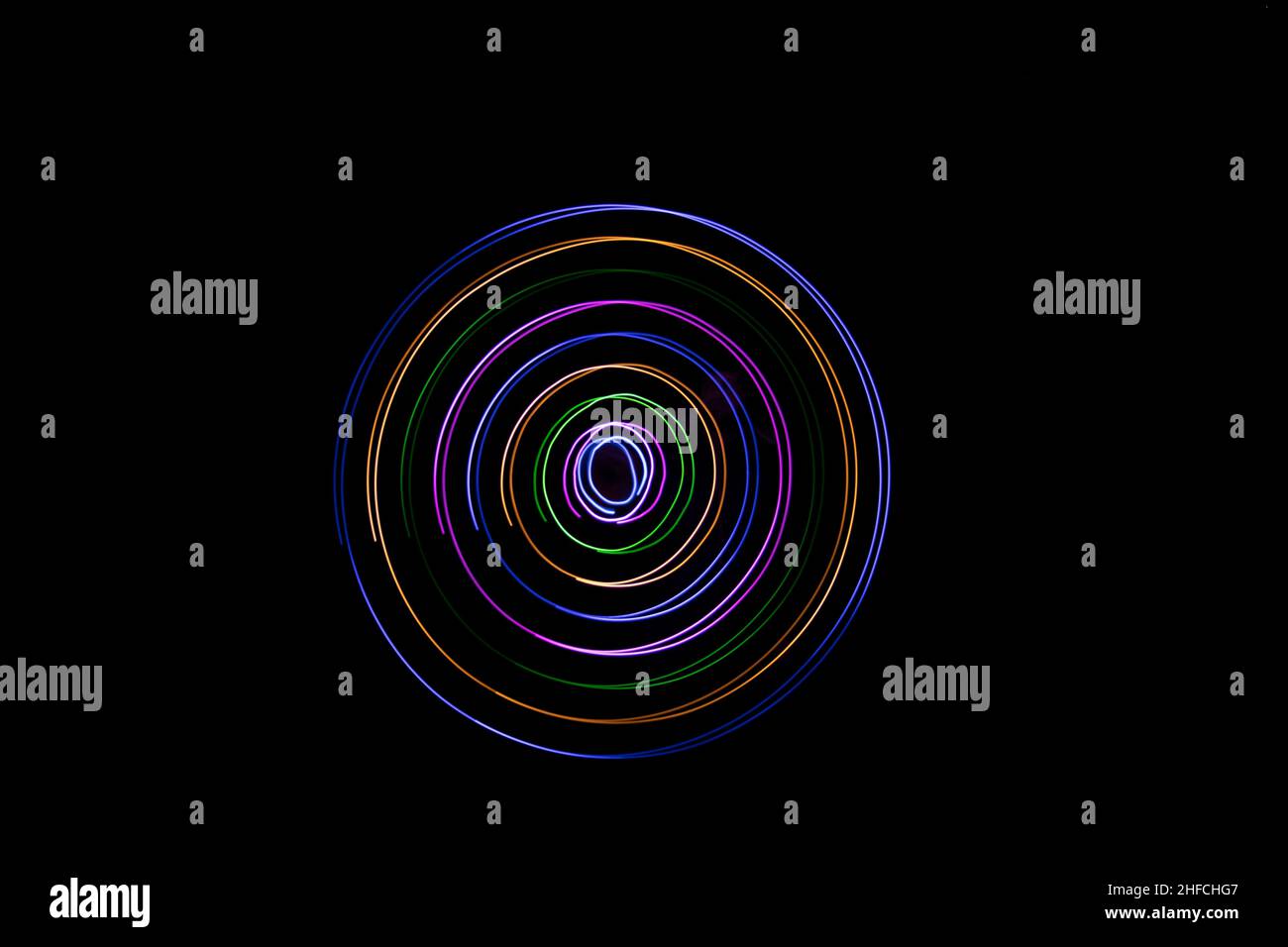 Multicolored circles on a black background Stock Photo