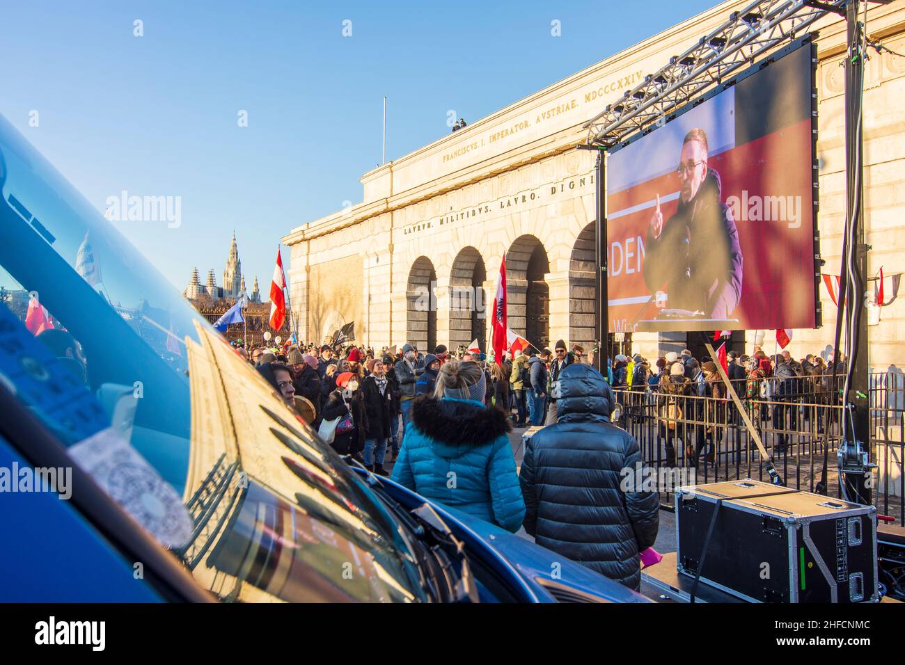 Wien, Vienna: Herbert Kickl, Chairman of the Freedom Party of Austria (FPÖ), speaks (broadcast on a screen) to demonstrators at a rally to protest aga Stock Photo