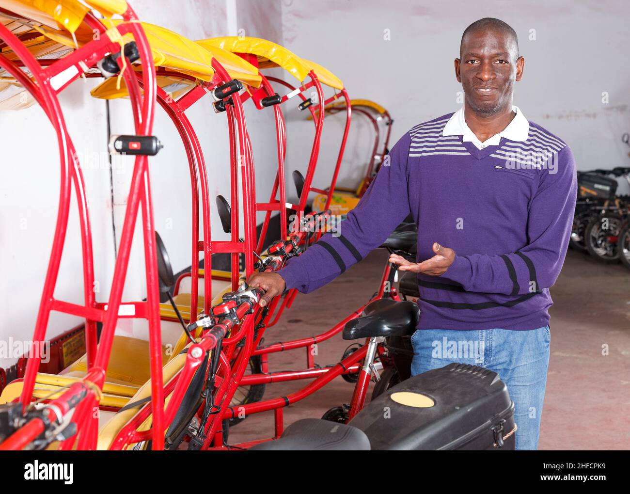 African-American man recommending rickshaw Stock Photo - Alamy
