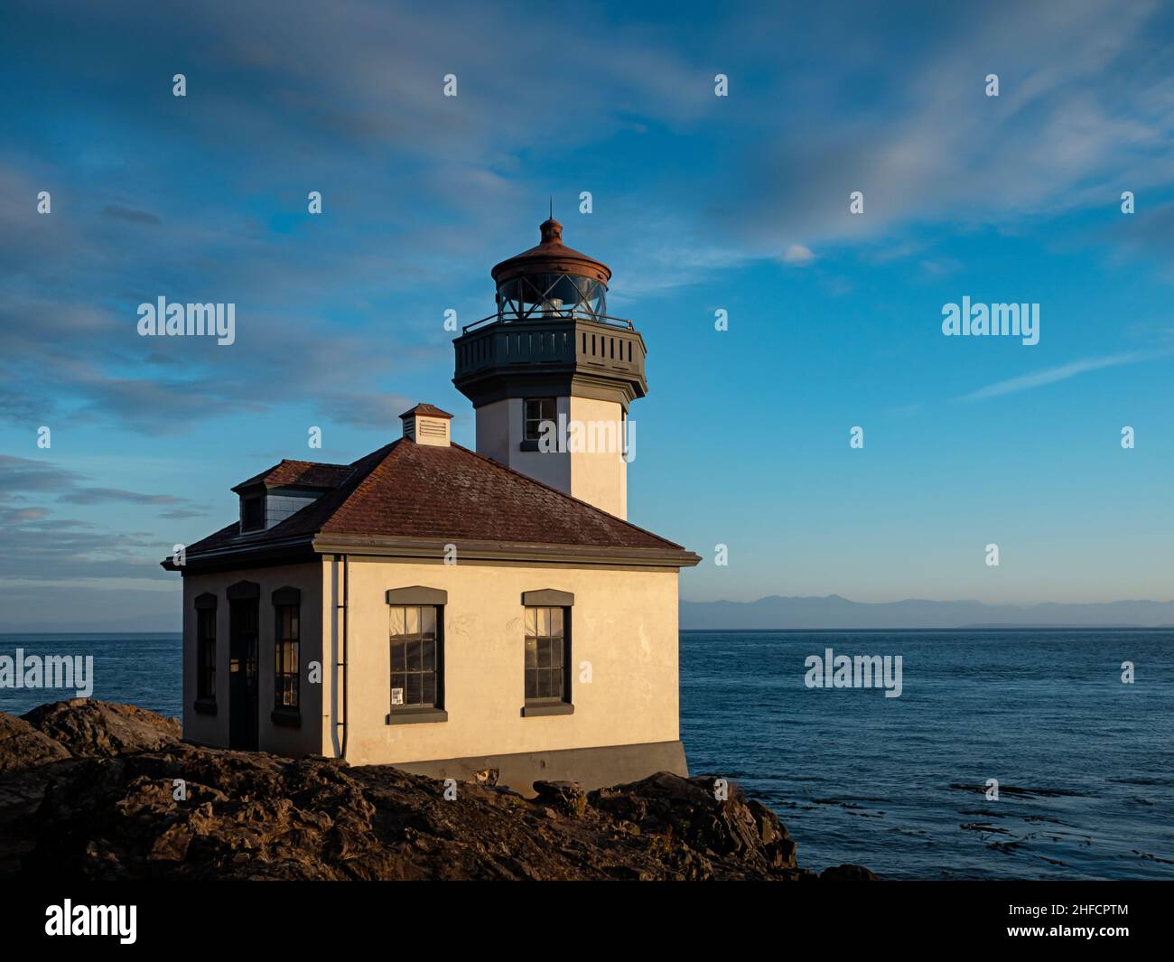 WA21120-00...WASHINGTON - Lime Kiln Lighthouse located on the shores of Haro Strait and is one of the most popular whale watching areas of San Juan Is Stock Photo
